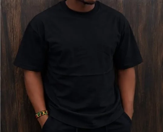 Man wearing a black heavyweight plain T-shirt
